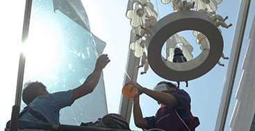 2 men installing Sunglo's Window Film