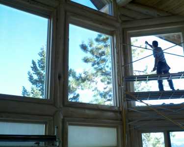 Installing Sunglo's Window Film with scaffolding